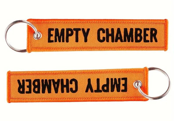 Llavero naranja con cámara vacía