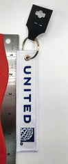 Llavero bordado en blanco y azul con el logotipo de United Airlines