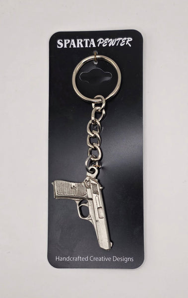 Sparta Pewter 9mm keychain on a black card with brand name.