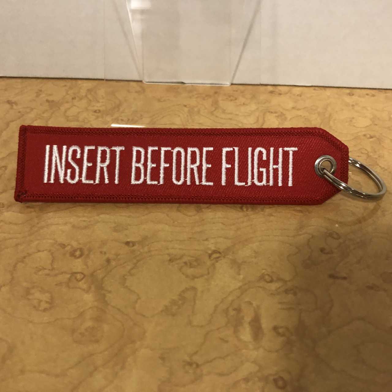Insert Before Flight keychain